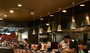 the kitchen and bar seating at Myers + Chang in Boston