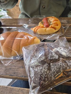 Front to back: chocolate black sesame bread, snail bread with peanut butter, hot dog bread at HiPizza in Taipei