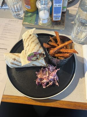 Sweetcorn [fritter] roti roll with a side of sweet potato fries.  at Turtle Bay in Newcastle Upon Tyne