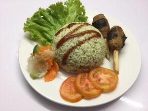 Lemongrass tofu drumsticks with vegetable side salad and green herbs rice.  at Sweet Root Vegetarian Restaurant  in Phnom Penh
