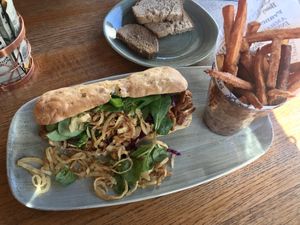 Hot dog with pulled planted and sweet potato fries at Hotel Schweizerhof Lenzerheide in Lenzerheide