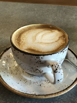 Coffee with soy milk. at Honest Greens - Castellana in Madrid