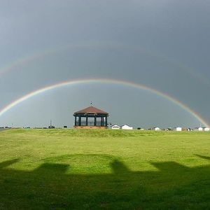Deal Bandstand, just across the road, crowned by a double rainbow!! at Walmer Fish & Chips in Deal