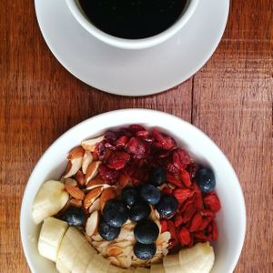 Americano and musli bowl with almond.milk. at Cafe 8.98 in Ao Nang