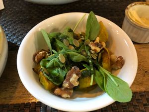 SideRoastedSweetPotatoes-SweetPotatoes,Arugula,Walnuts,PumpkinSeeds,Pesto.  at Cafe 8.98 in Ao Nang