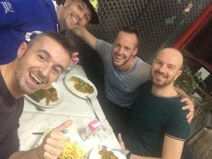 Friends sharing great food at Little Aladdin in Manchester