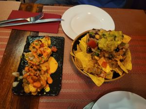 Vegan fried plantain and nachos. at Andino Gastrobar in Malaga