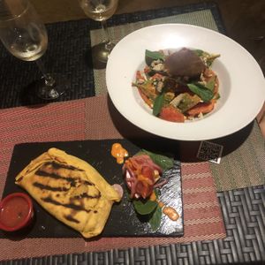 La empanada vegana y la ensalada de tomate  at Andino Gastrobar in Malaga
