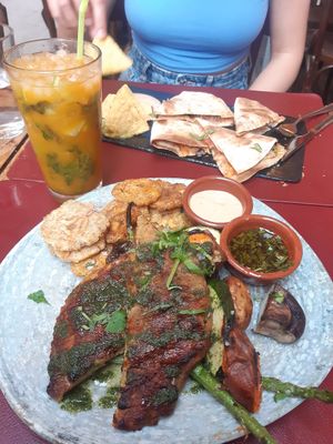 Vegan lentil steak with grilled veggies and fried plantain at Andino Gastrobar in Malaga