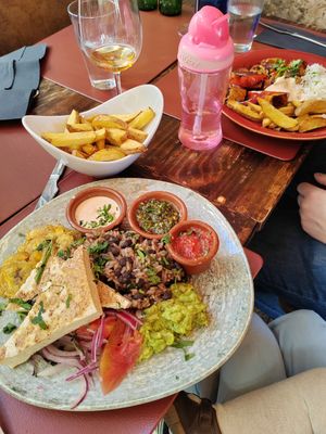 Tofu, fried plantain, rice and beans, guac, tomatoes, onions, dips. Sooo delish! at Andino Gastrobar in Malaga