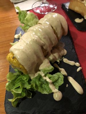 Corn on the cob drenched in sauce.. ask for the vegan menu when ordering  at Andino Gastrobar in Malaga