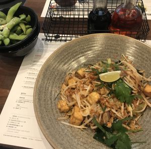 Vegan pad Thai with tofu and edamame at Wagamama - Designed Outlet in Roermond