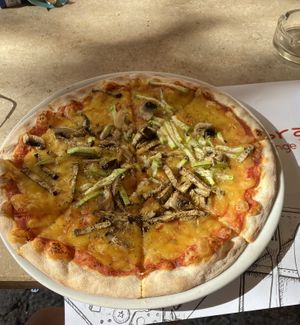 Pizza with vegan cheese at Ombra Restaurant in Kotor