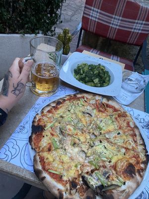 Vegan pizza with potato side and beer!  at Ombra Restaurant in Kotor