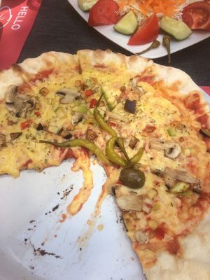Vegetarian pizza with vegan cheese at Ombra Restaurant in Kotor