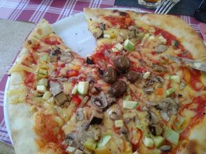 Vegetarian pizza with plant-based 'cheese'  at Ombra Restaurant in Kotor