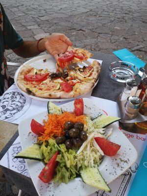 Vegan pizza y salad at Ombra Restaurant in Kotor