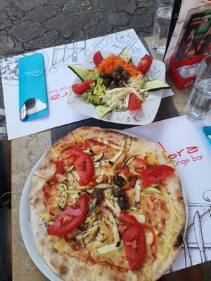 Vegan pizza y salad at Ombra Restaurant in Kotor
