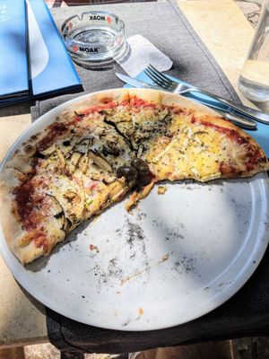Vegan pizza with yummy cheese at Ombra Restaurant in Kotor