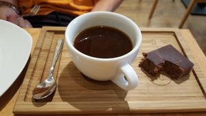 american coffee and vegan desert at Madal Food in Budapest