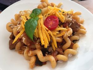 Vegan glutenfree pasta w/ tomato-zucchini sauce, soy cubes and vegan cheese at Madal Food in Budapest