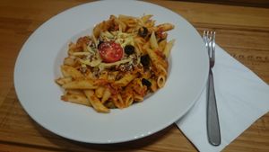 Delicious pasta with tomato sauce and capri berry  at Madal Food in Budapest