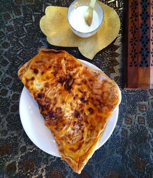 This is our favourite and best seller. Tomatoes, pepper Moroccan pancake (Mhjab). 100% vegan. Have it on its own, toasted with pesto, houmous or cheese. Wrap it with falafel, houmous and salad is a meal it self. Or have our beans tagine with it. Low in gluten and high in protein. *we have a spinach one too!  at The Coffee Lover's Cafe in South West London