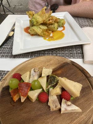 Fried zucchini flowers with pepper sauce & the vegan cheeseboard, both were absolutely delicious! The flowers were delicate but crunchy and the cheeses had a great variety!   at L'OV Osteria Vegetariana in Florence