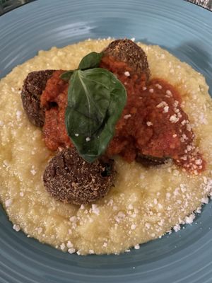 Vegetables patties, garlic, tomato sauce, polenta  at L'OV Osteria Vegetariana in Florence