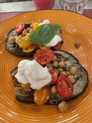 Roasted aubergine with chickpeas, tomatoes and a vegan cheese.  at L'OV Osteria Vegetariana in Florence