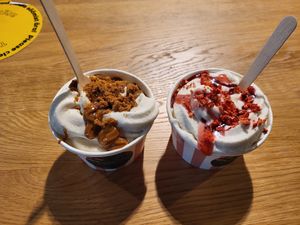 Oatly soft serve ice cream. Cookie crumbs on left and strawberry on right. at Veg Machine in Tallinn