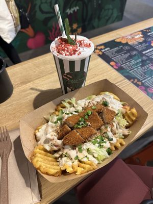 Loaded fries with chickn tenders + strawberry milkshake 💚  at Veg Machine in Tallinn