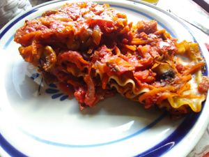 Lasagna with Mushrooms, carrot, tomato and olives. at Loving Hut - San Cristobal in San Cristobal De Las Casas
