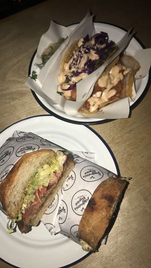 Torta de milanesa y tacos at La Taqueria Vegiee in Tijuana