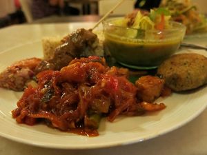 Nasi Campur is a traditional Indonesian dish. It is served with Balinese curry soup and homemade sambal. Here’s how their vegan version goes: tofu and tempeh sate with peanut. at Clear Cafe in Ubud