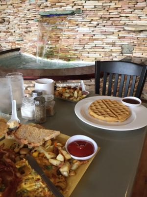 Vegan waffles w/ rice paper bacon & home fries! Yeah baby! at Water Garden Cafe in Cleveland