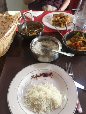 Plain naan, vegetable curry, aloo gobi, white rice. Not pictured: onion bhaji. at Curry Park in Crete