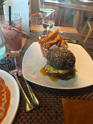 mint watermelon juice and black burger  at TIME Vegetarian Kitchen in Santo Domingo