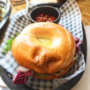 Breakfast bagel with yolk at Grumpy Panda Slice Shop & Deli in Gateshead