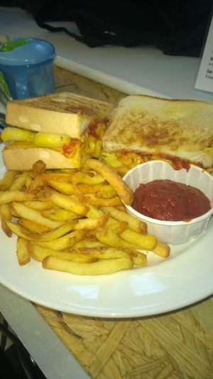 Mac 'n' cheese pizza sandwich with fries and dip at Grumpy Panda Slice Shop & Deli in Gateshead
