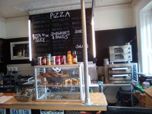 Menu board and counter at Grumpy Panda Slice Shop & Deli in Gateshead
