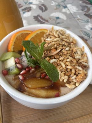 Coconut oat porridge with caramelized fruit and nut granola  at The Juicery Cafe in Pokhara