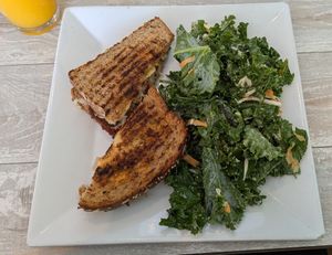 Ruben with kale slaw and fresh squeezed OJ🤗 at Simply Green Cafe in Ramsey