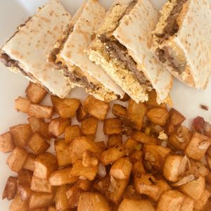 Breakfast Quesadilla & Potatoes  at Simply Green Cafe in Ramsey