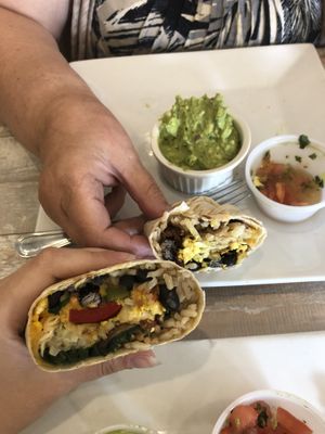 Our delicious vegan breakfast burritos!! at Simply Green Cafe in Ramsey