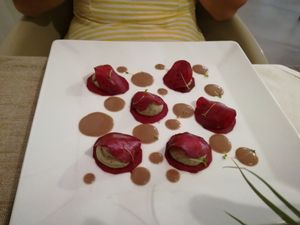 Red beet ravioli filled with a cashew cream at Officina Verde in Riva Del Garda