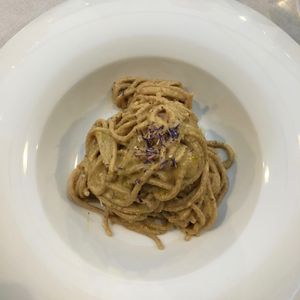 Spaghetti with walnut and yellow pepper pesto at Officina Verde in Riva Del Garda