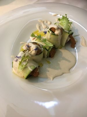 Zucchini rolls filled with tofu, dried tomatoes olives and capers. Served with cashew cream at Officina Verde in Riva Del Garda