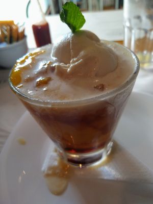 Dessert of the day, with mango sorbet, mango pieces, some sort of alcohol shot, and ice cream. at Camaraderia Gastrobar in Belo Horizonte