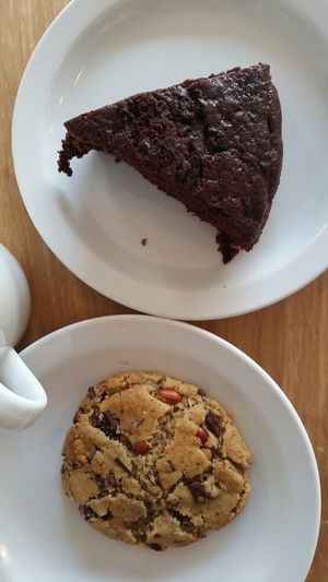 Rose/chocolate cake and peanut peanut butter chocolate chip cookie  at Herbivore in Cardiff